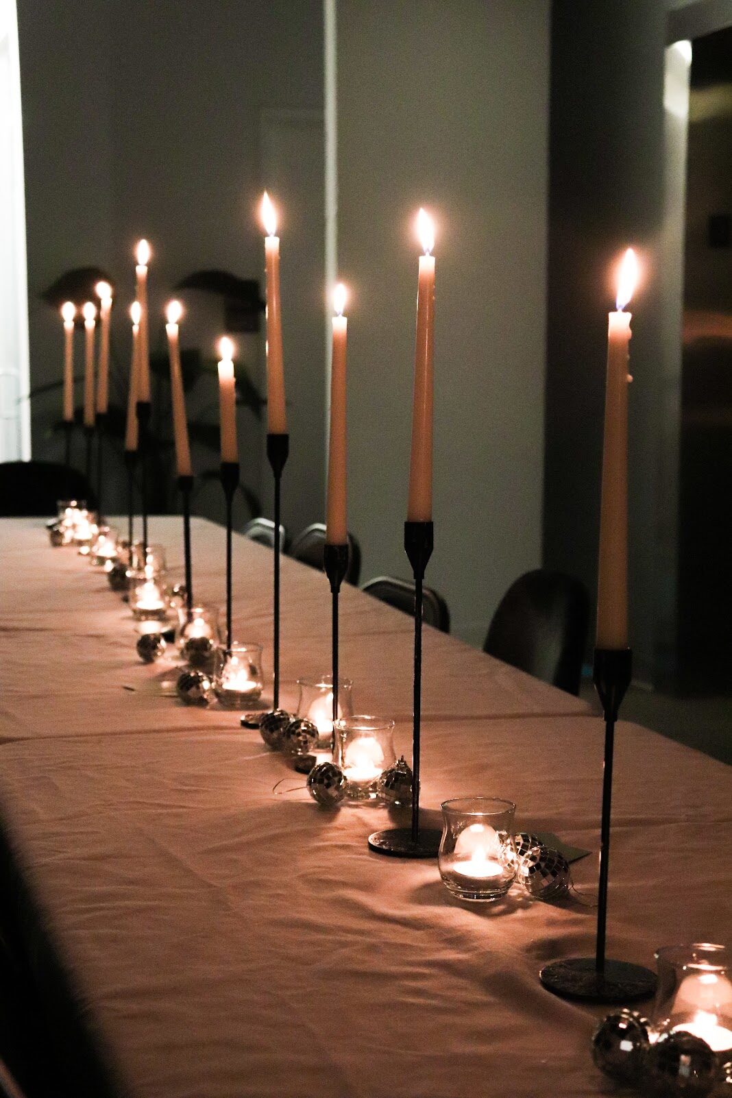 A long table set with candles